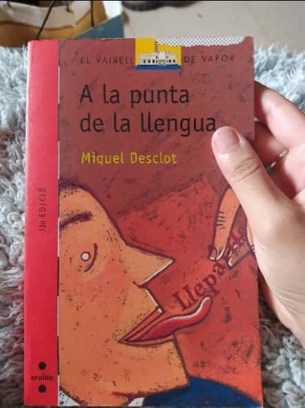 a la punta de la llengua